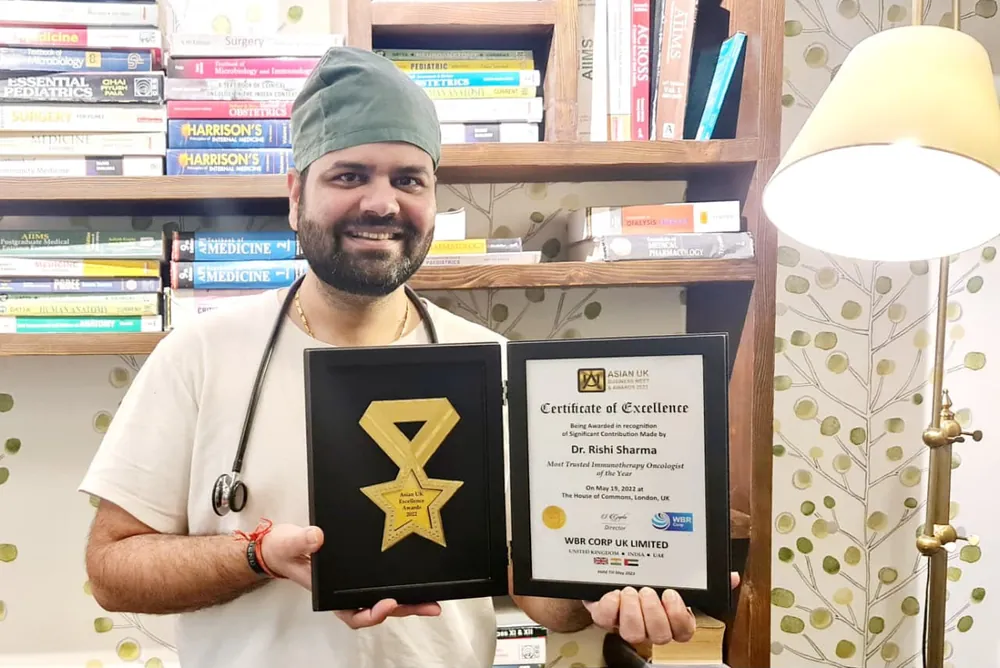 Dr. Rishi Sharma with his Certificate of Excellence