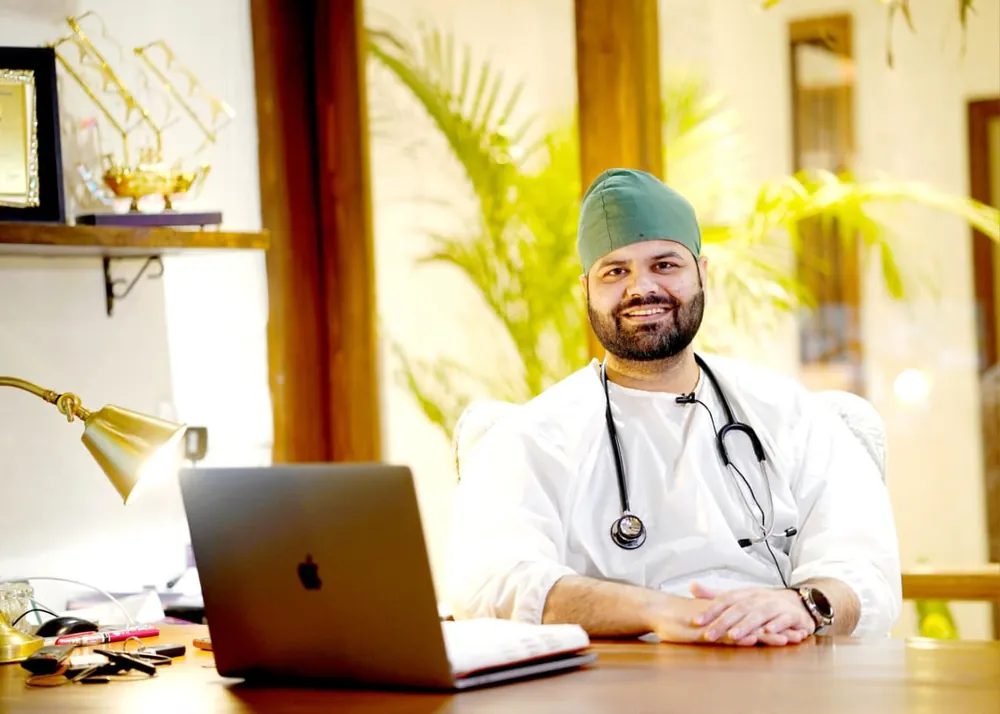 Dr. Rishi Sharma at his consultation desk